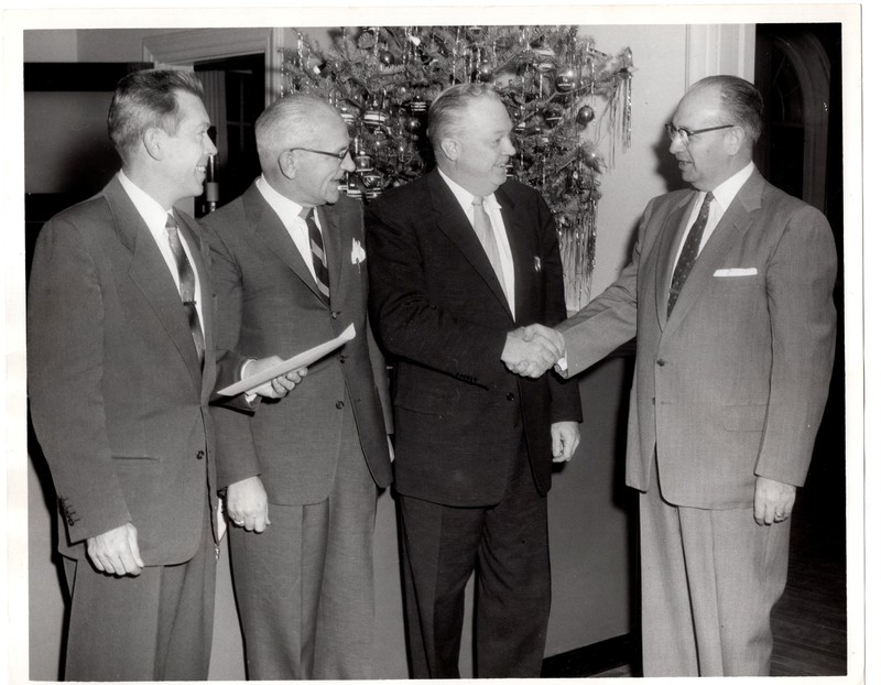 1 black and white photograph 8x10 Mayor Edward Meyer H. Radford Beucler and two unidentified subjects at Christmas event undated.jpg