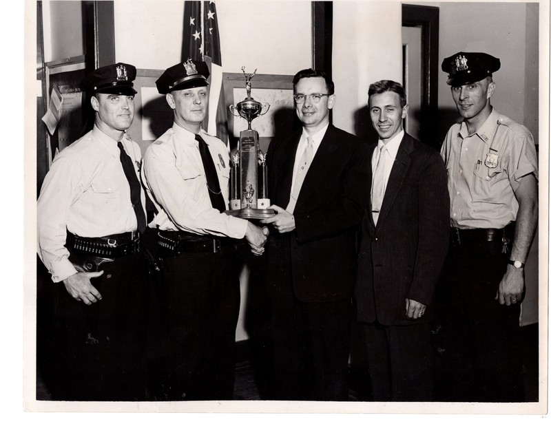 1 black and white photograph 8x10 safety patrol ward. pictured sgt. gavin blanc capt. edward jackob superintendent of Schools Donald C Jess and Officer Eugene Jackobsen 1955-56.jpg