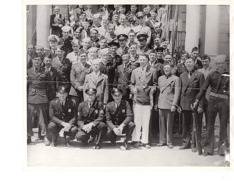 1 black and white photograph 8 x 10 group of World War I and World War II veterans outside Borough Hall Memorial Day 1946.jpg
