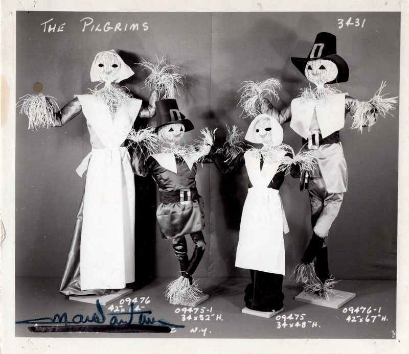 1 black and white photograph 4 pilgrim scarecrows from unnamed event undated.jpg