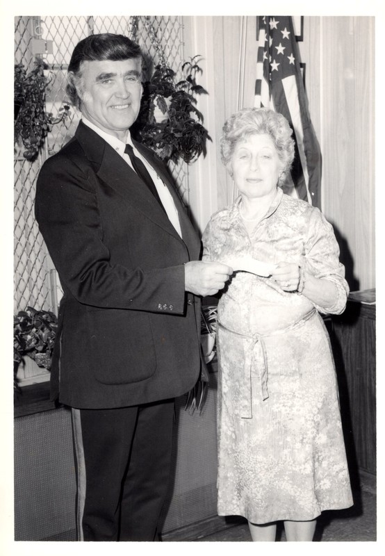 1 black and white photograph 2 unnamed people standing together undated.jpg