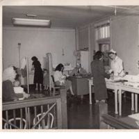 1 black and white photograph 8 x 10 Board of Health pictured Dr Lombar and public health Nurse Ruth Radcliffe providing care 1952