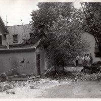 2 black and white photographs 8 x 10 Public Works Department tearing down home