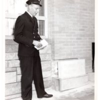 1 black and white photograph (8x10) George Rosein laying cornerstone of Alert Fire House, West Church Street, 1962.jpg