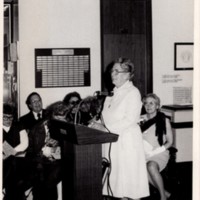 1 black and white photograph Bea James speaking at podium, 1979