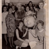 1 black and white photograph gifting a globe for the children&#039;s room