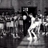 1 black and white photograph basketball game in Roy W Brown gym