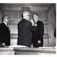 1 black and white photograph (8x10) member of the fire department and two Borough officials at Borough Hall, Jan. 1, 1962.jpg