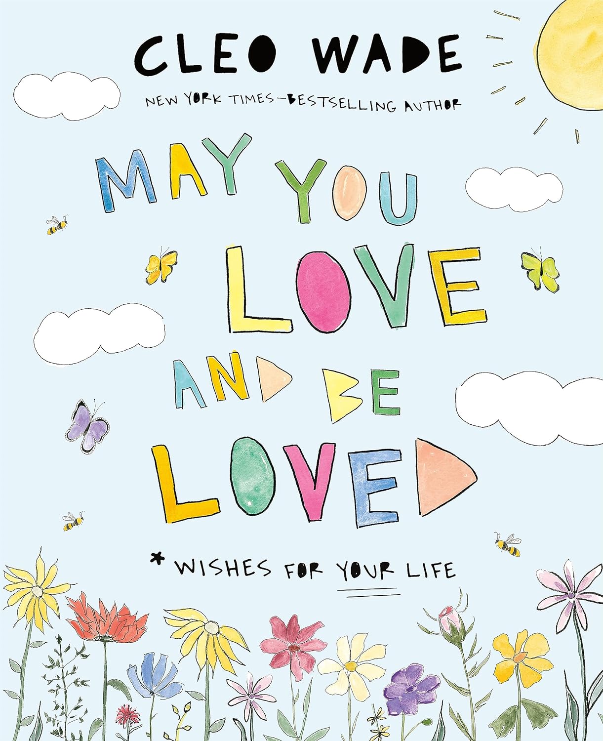 Cover for a children's picture book. Background is a blue sky with a sun. Spring flowers line the bottom edge of the cover. Butterflies fly around. Text reads, "Cleo Wade. May You Love and Be Loved. *Wishes For Your Life."