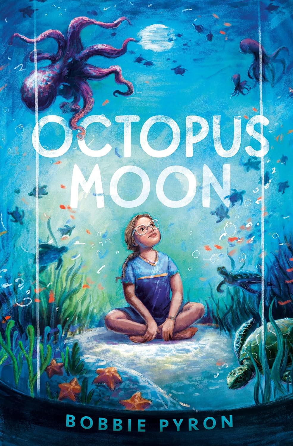 Cover for a children's chapter book. A young sits in the center of an aquarium tank, looking up at the marine life. Text reads, "Octopus moon. Bobbie Pyron."
