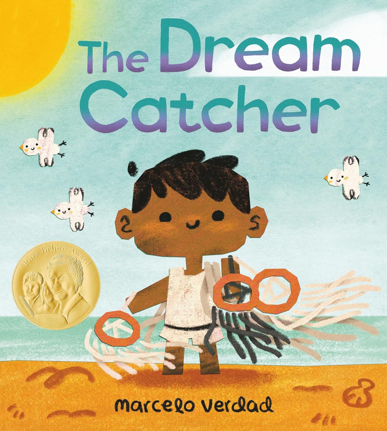 Cover for a children's picture book. A young boy holds dream catchers on the beach on a sunny summer day. text reads, "The Dream Catcher. Marcelo Verdad."