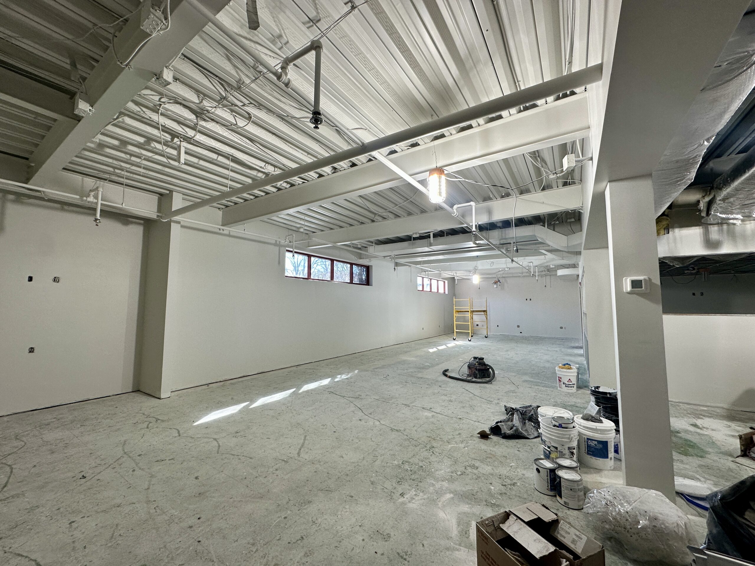 Image of new teen room construction. Walls have been put up and painted white.