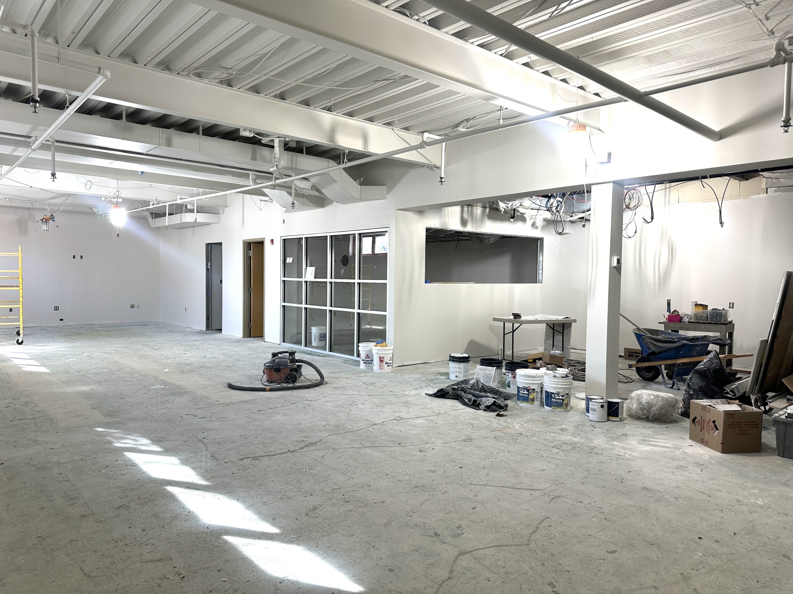 Image of new teen room construction from another angle. Walls have been put up and painted white.