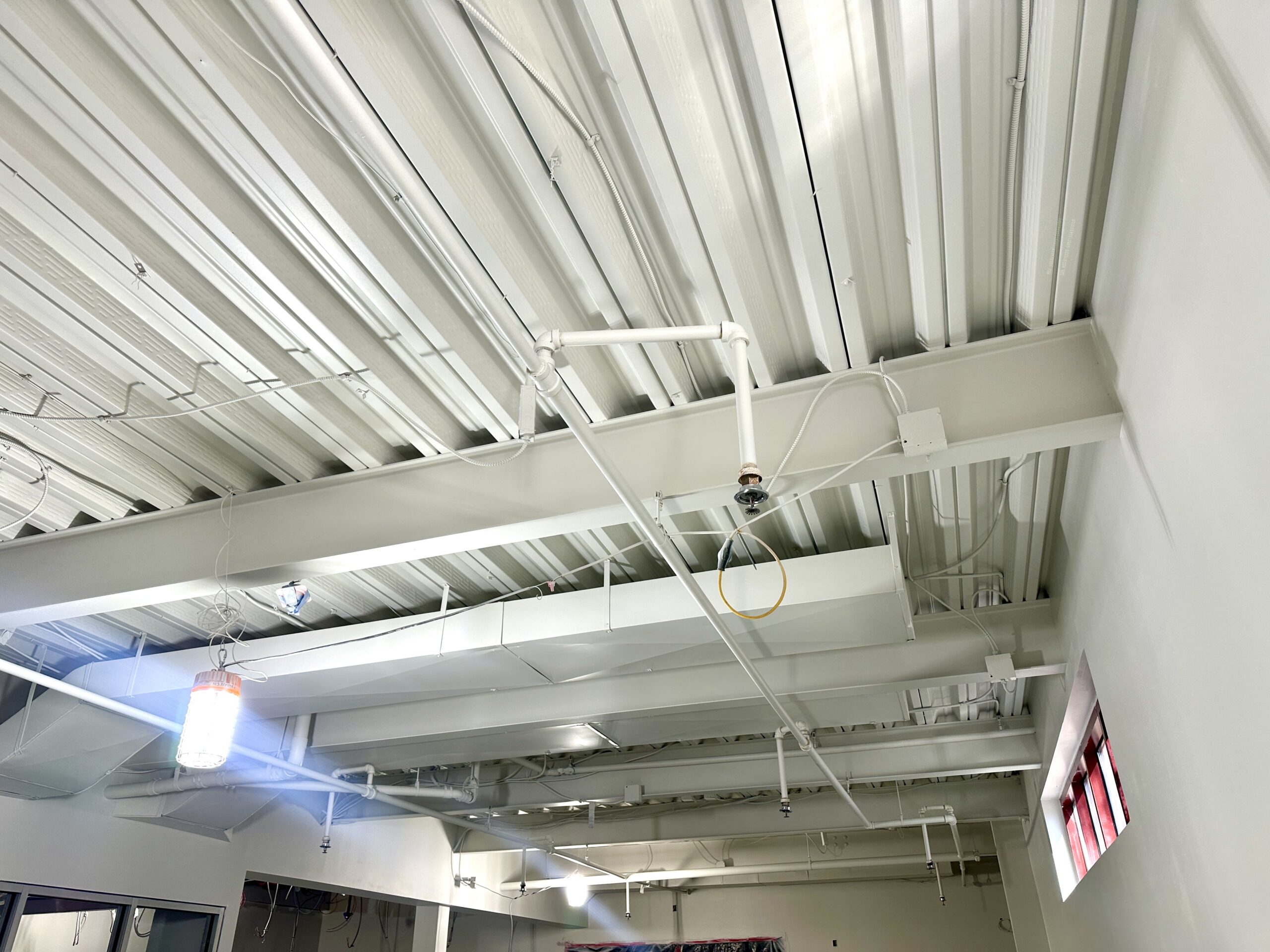 Image of new teen room construction. Ceiling support has been established.