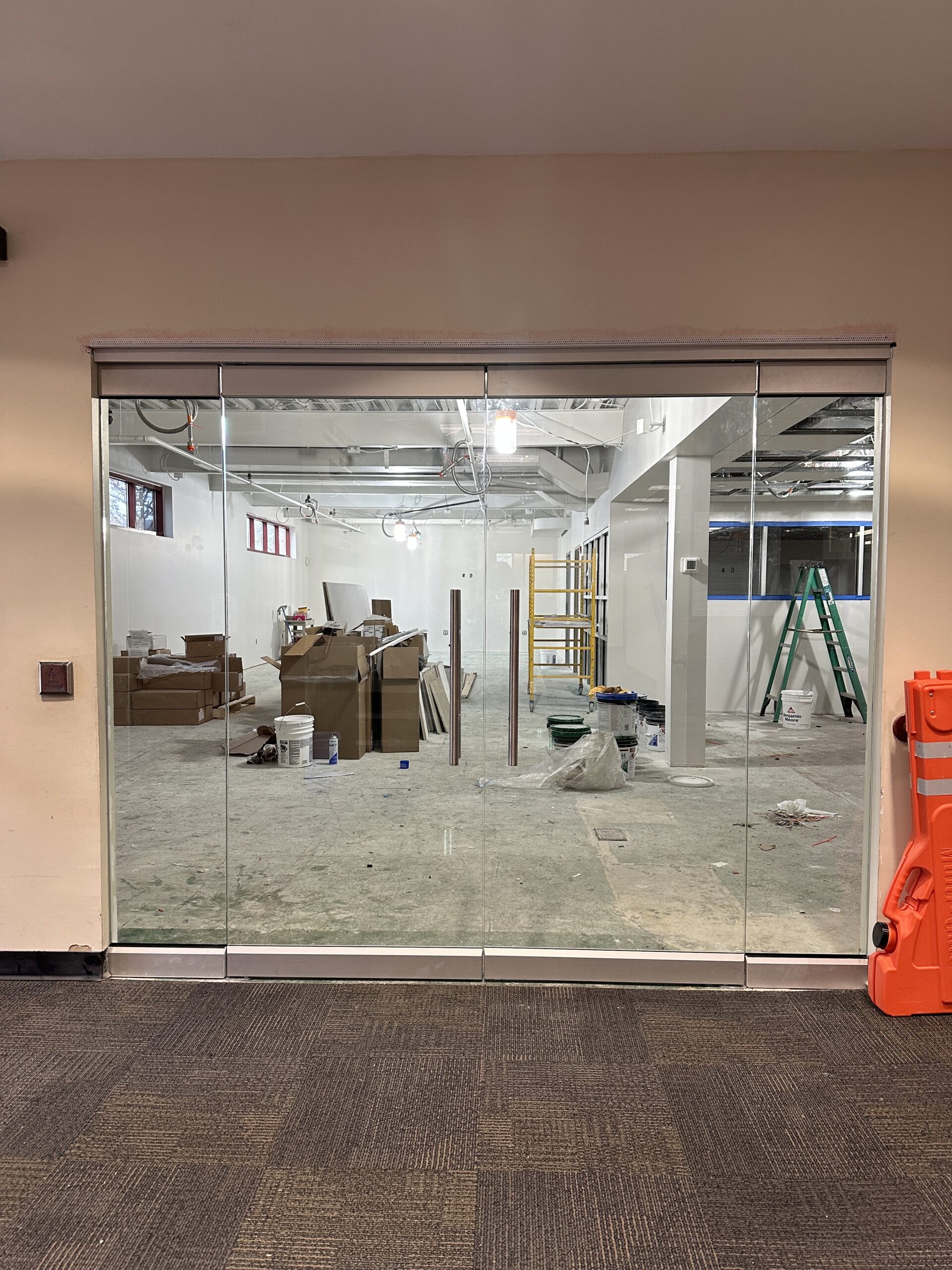 Image of week 9 of the new teen room construction. Glass doors have been installed.